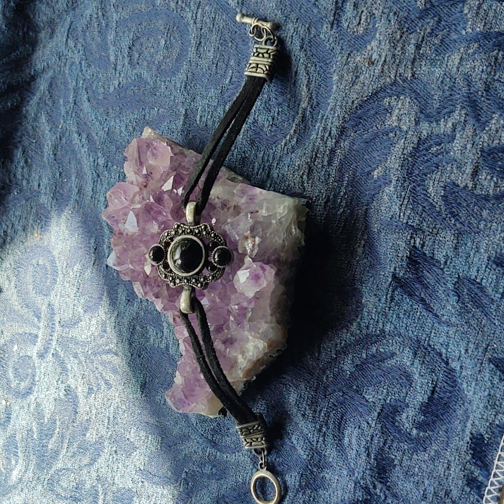Onyx and silver bracelet featuring leather and silver embellishments